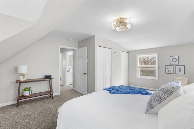 1100 Northdale Ave, Saint Louis, MO 63138 - carpeted bedroom with vaulted ceiling, two closets, and baseboards