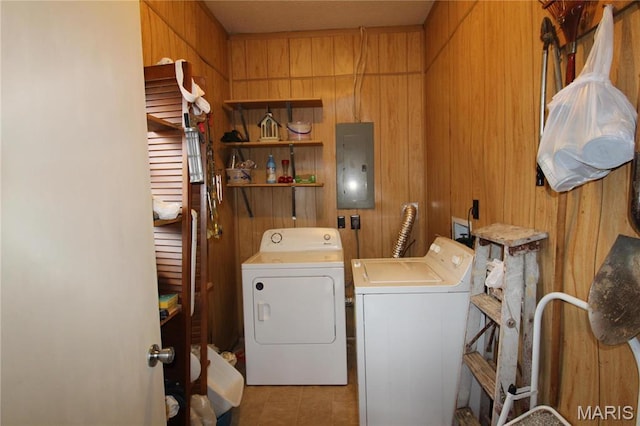 2013 Catalina Dr, West Plains, MO 65775 - washroom with washer and clothes dryer, electric panel, wooden walls, and tile patterned floors