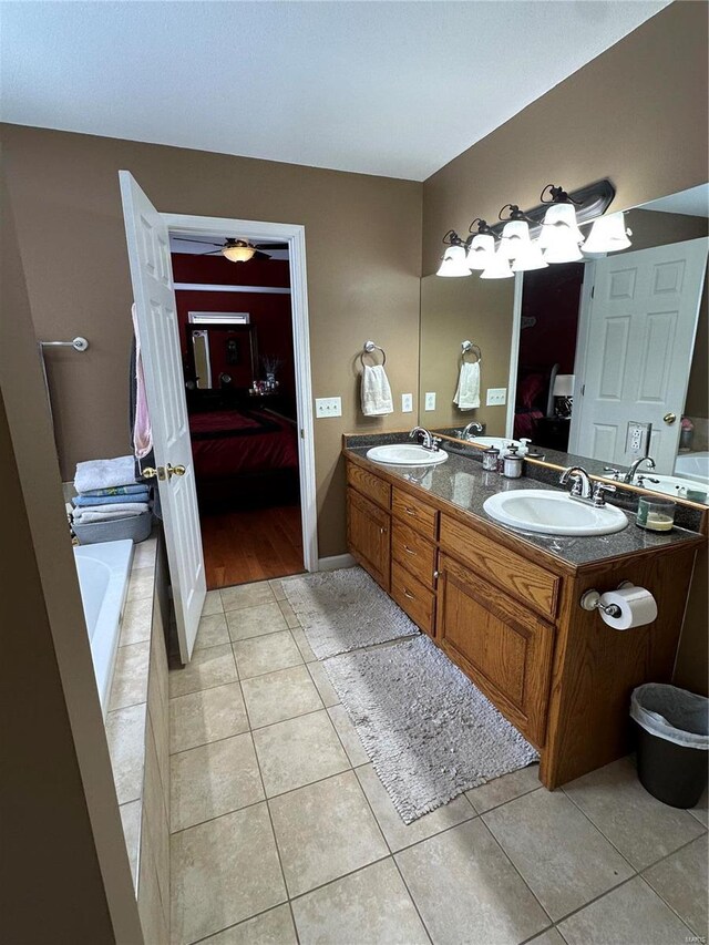 121 Stull Dr, Benton, MO 63736 - bathroom with ensuite bathroom, tile patterned floors, double vanity, and a ceiling fan