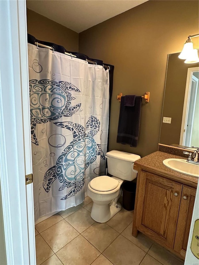 121 Stull Dr, Benton, MO 63736 - full bath with tile patterned floors, toilet, vanity, and a shower with shower curtain