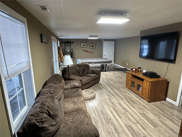 121 Stull Dr, Benton, MO 63736 - living area featuring light wood-style flooring, baseboards, and a drop ceiling