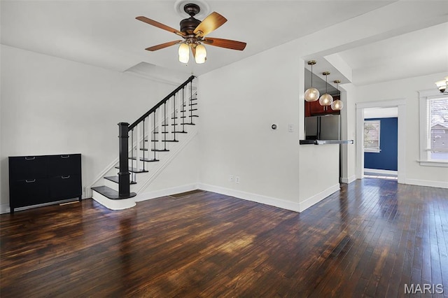 2326 Bellevue Ave, Saint Louis, MO 63143 - unfurnished living room with dark wood-type flooring, stairs, baseboards, and a ceiling fan