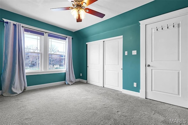 2326 Bellevue Ave, Saint Louis, MO 63143 - unfurnished bedroom with carpet flooring, baseboards, a closet, and a ceiling fan