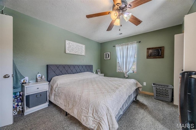 bedroom with carpet flooring, a textured ceiling, ceiling fan, and baseboards