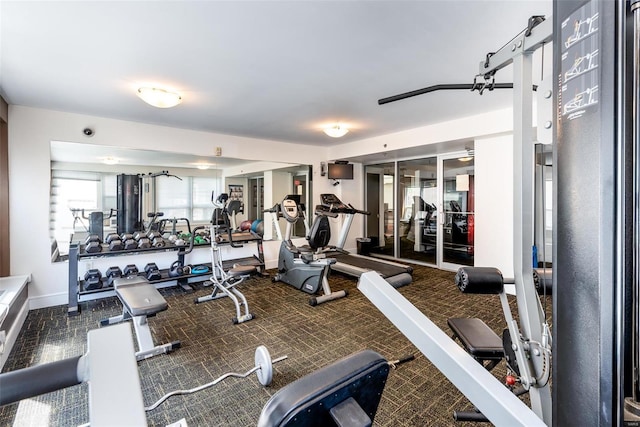 workout area with carpet and baseboards