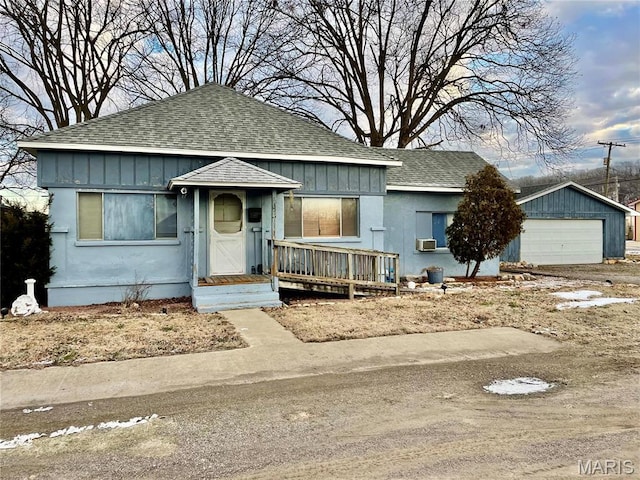 115 Cook Ave, Chaffee, MO 63740 - bungalow-style house featuring roof with shingles, a garage, and board and batten siding