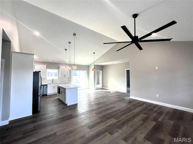 210 Sunny Dr, Rolla, MO 65401 - unfurnished living room with a sink, high vaulted ceiling, dark wood-style flooring, a ceiling fan, and baseboards