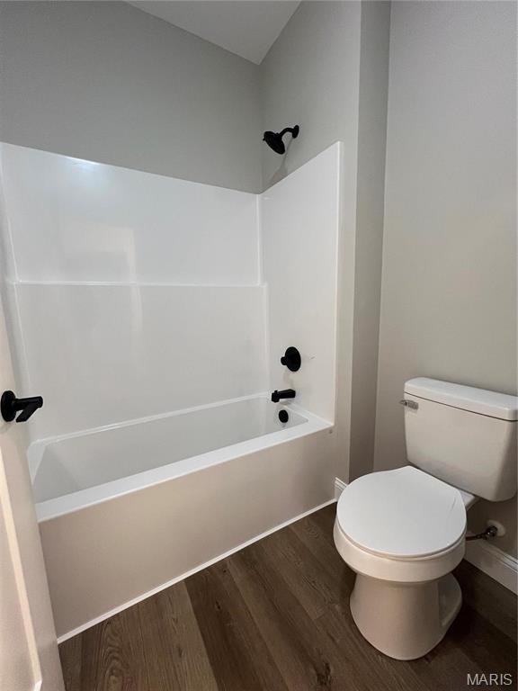 210 Sunny Dr, Rolla, MO 65401 - full bath with wood finished floors, toilet, and tub / shower combination