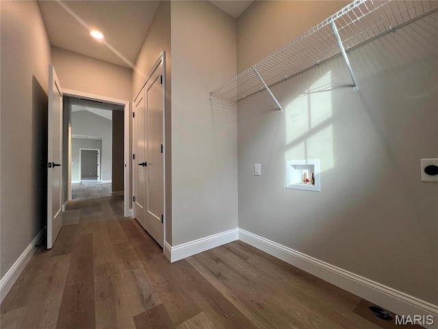 210 Sunny Dr, Rolla, MO 65401 - clothes washing area featuring electric dryer hookup, washer hookup, baseboards, wood finished floors, and recessed lighting
