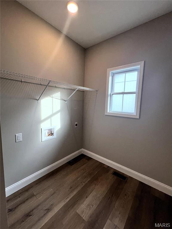 210 Sunny Dr, Rolla, MO 65401 - laundry area featuring hookup for an electric dryer, hookup for a washing machine, baseboards, and dark wood-style floors