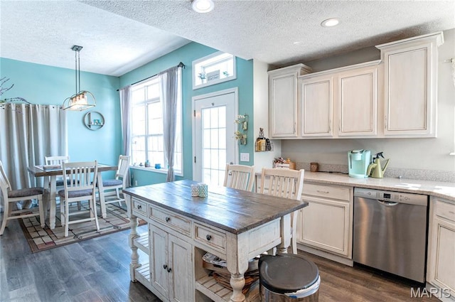 10415 Summerfield Dr, Rolla, MO 65401 - kitchen featuring dishwasher, a textured ceiling, dark wood-style flooring, decorative light fixtures, and white cabinets