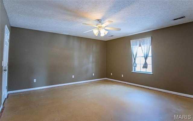 10415 Summerfield Dr, Rolla, MO 65401 - empty room featuring ceiling fan, concrete floors, baseboards, and a textured ceiling