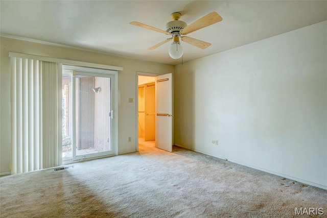 unfurnished bedroom with carpet floors, baseboards, and ceiling fan