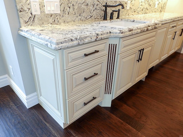 267 Saint Andrews Dr, Saint Albans, MO 63073 - detailed view of a sink, decorative backsplash, wood finished floors, and baseboards