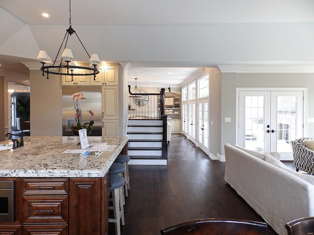 267 Saint Andrews Dr, Saint Albans, MO 63073 - kitchen with a chandelier, french doors, crown molding, light stone countertops, and dark wood-style flooring