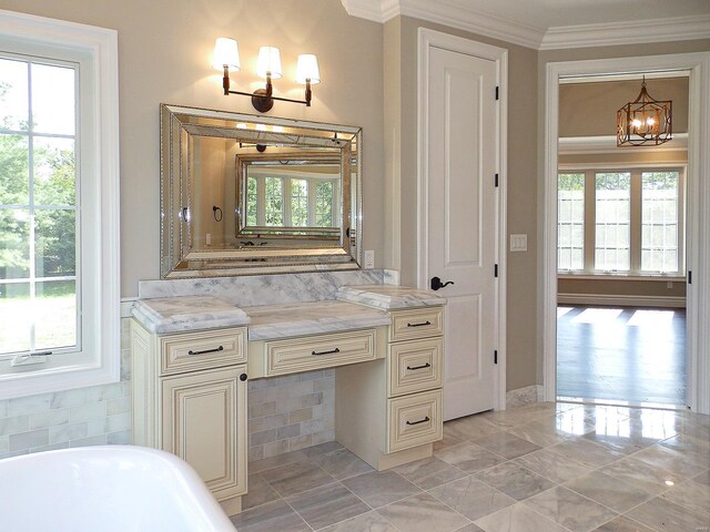 267 Saint Andrews Dr, Saint Albans, MO 63073 - bathroom with a chandelier, ornamental molding, plenty of natural light, a soaking tub, and vanity
