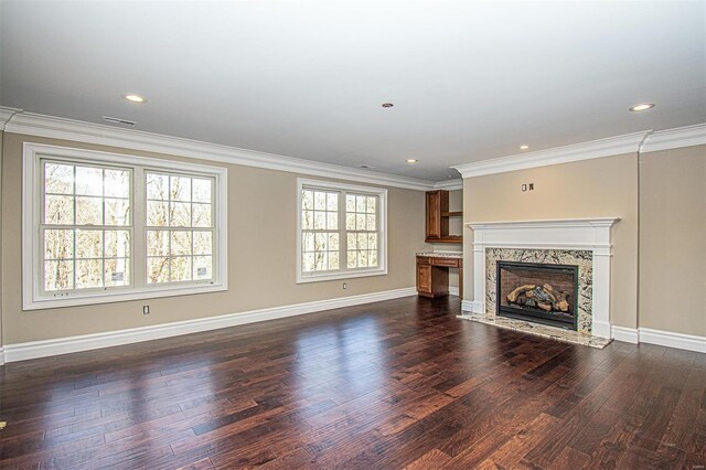 267 Saint Andrews Dr, Saint Albans, MO 63073 - unfurnished living room featuring dark wood-style flooring, baseboards, a high end fireplace, crown molding, and recessed lighting