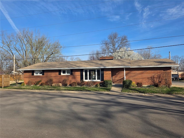 111 Linn Dr, Saint Genevieve, MO 63670 - ranch-style house featuring brick siding, a chimney, and fence
