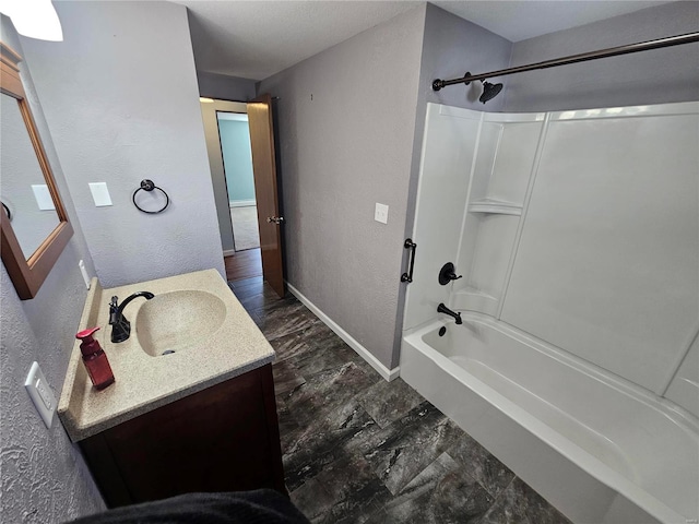 111 Linn Dr, Saint Genevieve, MO 63670 - full bathroom with a textured wall, shower / tub combination, vanity, and baseboards