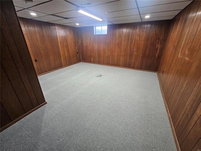 111 Linn Dr, Saint Genevieve, MO 63670 - below grade area with carpet, wood walls, and a drop ceiling