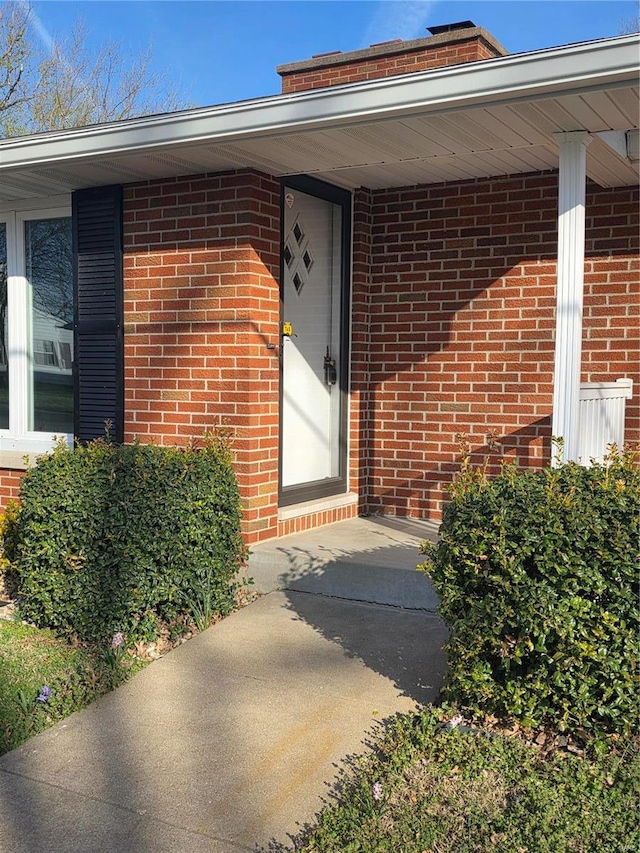 111 Linn Dr, Saint Genevieve, MO 63670 - view of exterior entry featuring brick siding