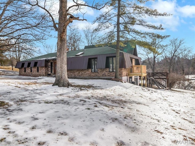 3553 Evergreen Dr, Catawissa, MO 63015 - snow covered property featuring stone siding and stairs