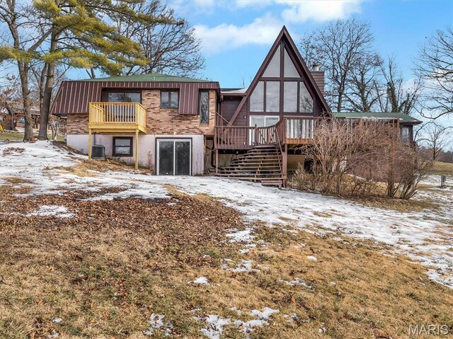 3553 Evergreen Dr, Catawissa, MO 63015 - snow covered back of property featuring stairway, a deck, and cooling unit