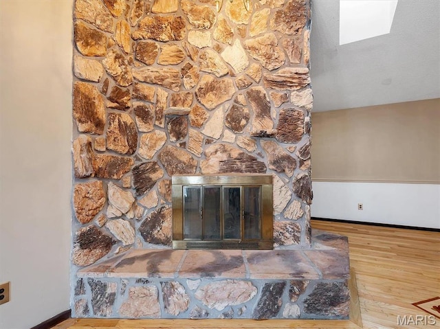 3553 Evergreen Dr, Catawissa, MO 63015 - detailed view of wood finished floors, a fireplace, and baseboards