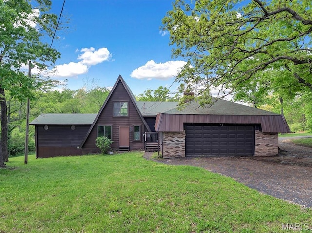 3553 Evergreen Dr, Catawissa, MO 63015 - a-frame style home with a front yard, brick siding, dirt driveway, a chimney, and a garage