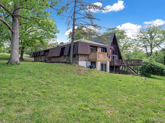 3553 Evergreen Dr, Catawissa, MO 63015 - rear view of property featuring stairway, a yard, a wooden deck, metal roof, and a chimney