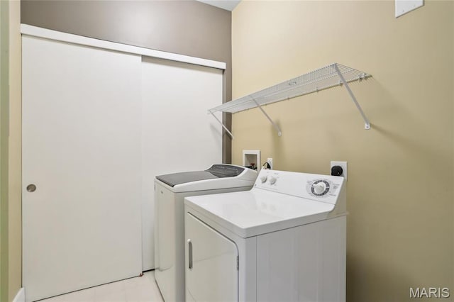 laundry area with washing machine and clothes dryer