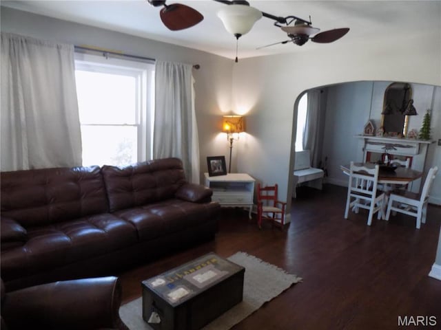 170 County Rd, Ironton, MO 63650 - living room featuring ceiling fan, arched walkways, and dark wood-style flooring