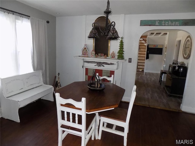 170 County Rd, Ironton, MO 63650 - dining area featuring arched walkways and wood finished floors