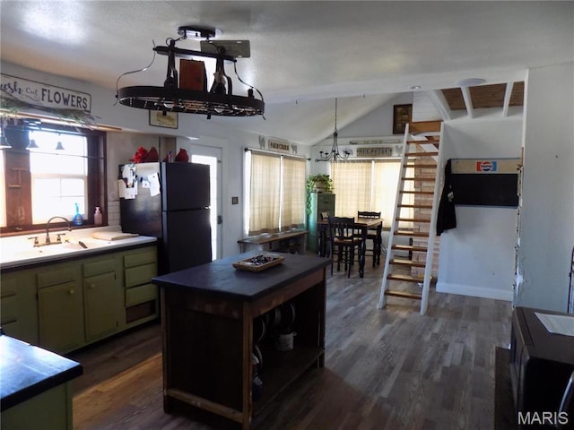 170 County Rd, Ironton, MO 63650 - kitchen featuring dark wood-style floors, freestanding refrigerator, lofted ceiling, light countertops, and a sink