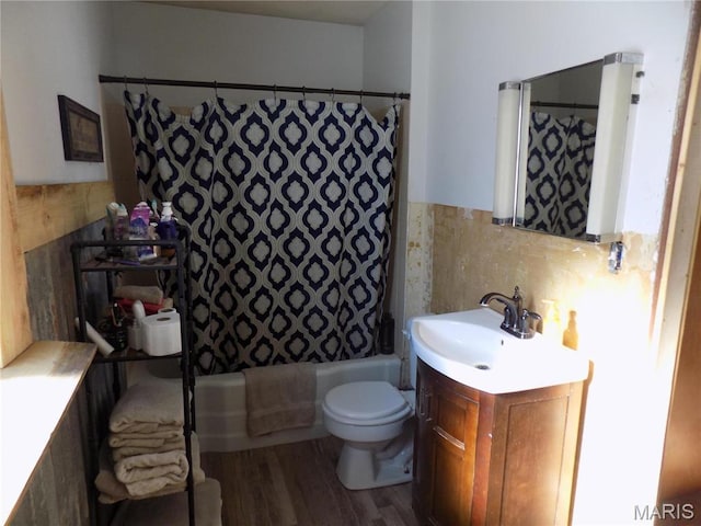 170 County Rd, Ironton, MO 63650 - full bathroom featuring toilet, wood finished floors, vanity, shower / tub combo, and tile walls