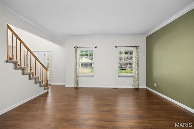 unfurnished living room featuring crown molding, wood finished floors, stairs, and baseboards
