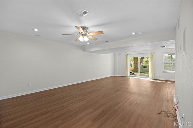 empty room with wood finished floors, baseboards, a ceiling fan, and recessed lighting