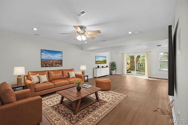 living area featuring recessed lighting, wood finished floors, ceiling fan, and baseboards