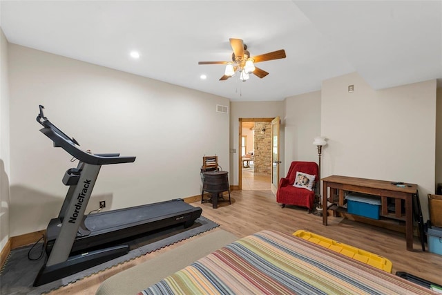 workout area with light wood finished floors, baseboards, a ceiling fan, and recessed lighting