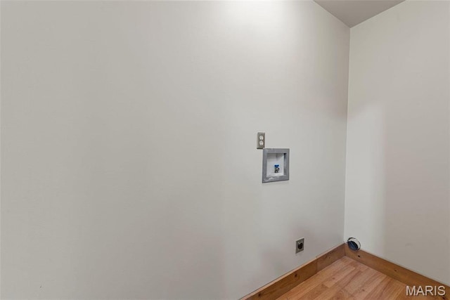 17102 Deer Mountain Rd, Marthasville, MO 63357 - laundry room with electric dryer hookup, light wood-type flooring, washer hookup, and baseboards