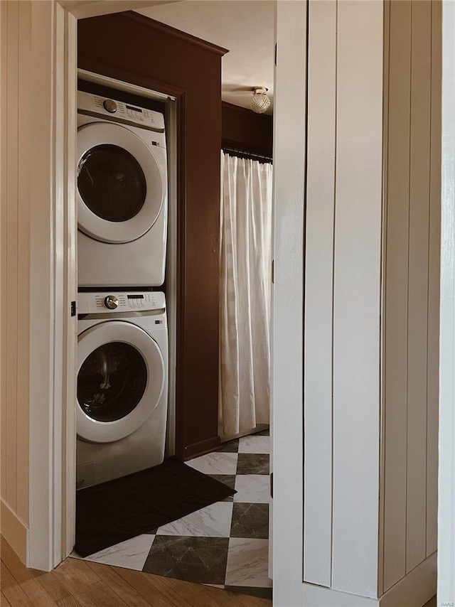 laundry area with estacked washer and dryer