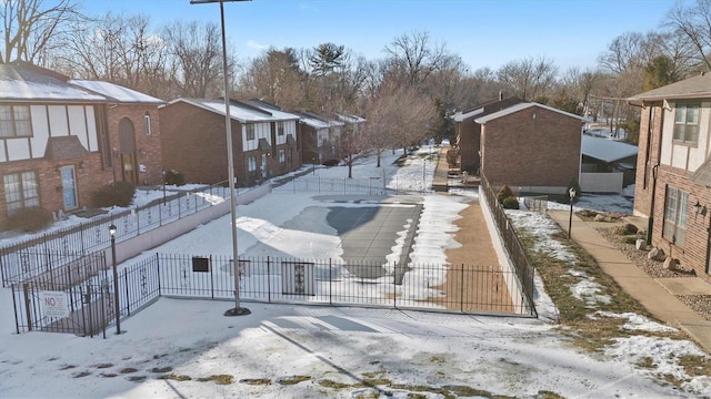 1229 N 17th St Unit 3, Belleville, IL 62226 - yard covered in snow with fence and a residential view