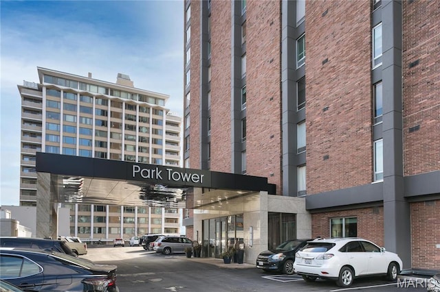 200 S Brentwood Unit 12F, Saint Louis, MO 63105 - view of apartment building / complex with uncovered parking