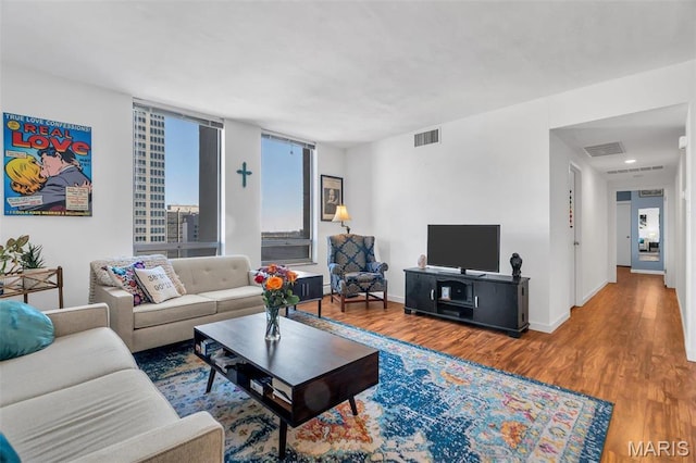 200 S Brentwood Unit 12F, Saint Louis, MO 63105 - living area with wood finished floors and baseboards