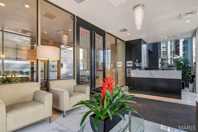 200 S Brentwood Unit 12F, Saint Louis, MO 63105 - reception with a wall of windows and recessed lighting