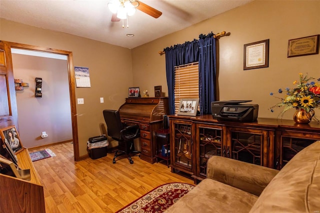 office with a ceiling fan, wood finished floors, and baseboards
