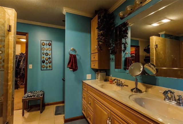 full bathroom with ornamental molding, double vanity, tile patterned floors, baseboards, and a textured ceiling