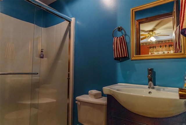 full bath featuring a stall shower, toilet, and vanity