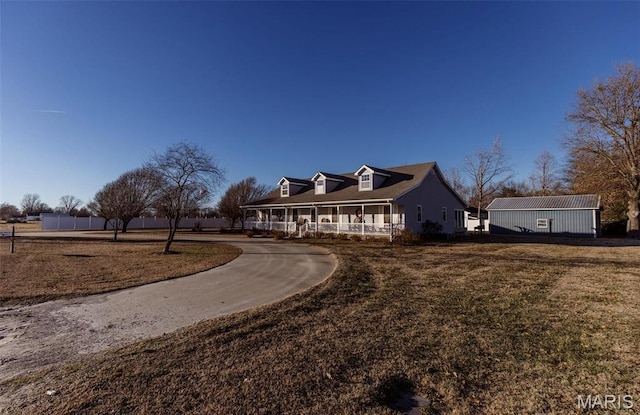 702 S 525th Rd, East Prairie, MO 63845 - view of front of home with a porch and a front lawn