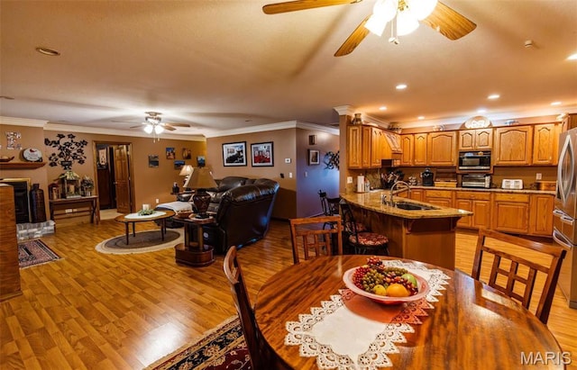 702 S 525th Rd, East Prairie, MO 63845 - dining room featuring ceiling fan, crown molding, light wood finished floors, and recessed lighting